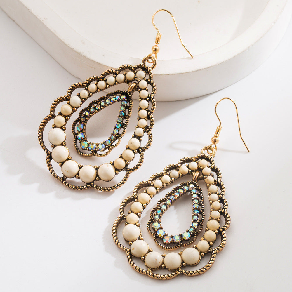 Wholesale Western style oval exaggerated cross earrings with white turquoise